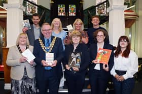 The Mayor of Wigan Coun Kevin Anderson and Mayoress Samantha Lloyd, chief execultive of Wigan Council Alison McKenzie-Folan with other Wigan Council members, welcome some of the members of the Angers Twinning delegation and exchange books in a ceremony at Wigan Town Hall last summer