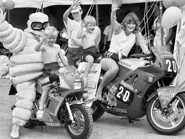 Enjoying a biker's fun day in aid of Wigan and Leigh Hospice at the Three Sisters race track, Bryn, with Michelin Man are Nerys Owen and brothers Derry and Noel Green on Sunday 19th of June 1988.