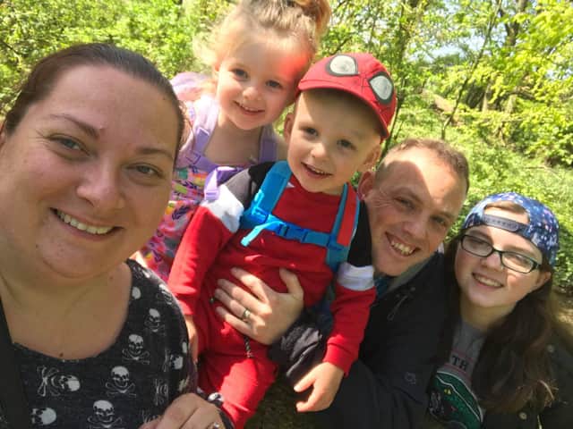 Oliver Wood with his wife, Gemma and their children.