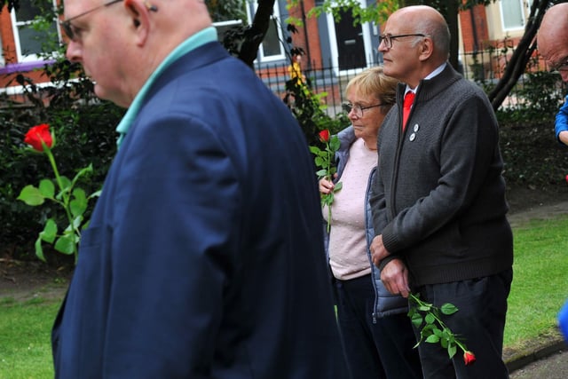 Members of the community attend the 10th annual Workers' Memorial Day, with a ceremony around the memorial tree and plaque in Mesnes Park, Wigan.