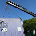 New vandal-proof changing facilities are hoisted into place at St Wilfrid's AFC