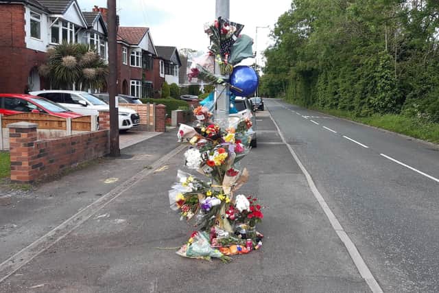 Floral tributes to Charlie Brogan on Spring Road