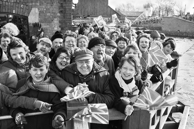 Enthusiastic spectators who crowded onto the canal side outside The Orwell pub at the Heritage Centre to await the Queen's arrival.