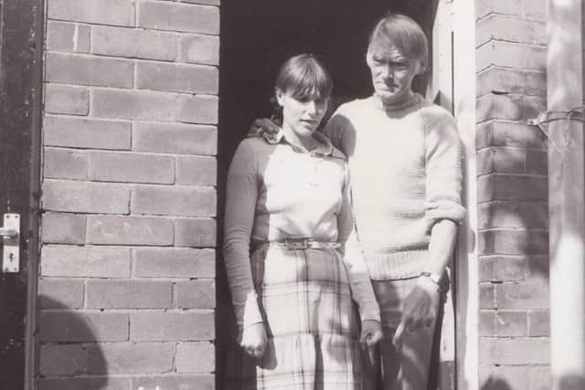 Norman and Pauline Green outside their home in West Street,  Higher Ince