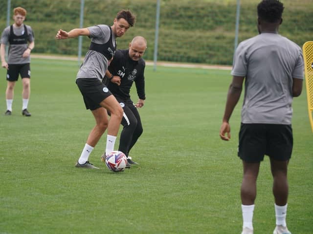 Boss Shaun Maloney gets stuck in