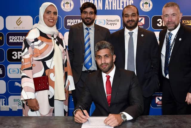 All smiles as a 'very exciting' agreement for Wigan Athletic is signed