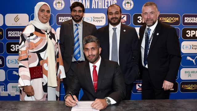 All smiles as a 'very exciting' agreement for Wigan Athletic is signed
