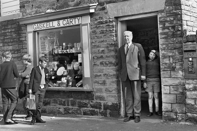 James Gaskell at the doorway of his general stores and sweet shop on the junction of Sandy Lane and St. James Road, Orrell, in October 1971.