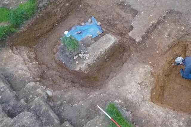 An archaeologist at work in the Aspull ring ditch