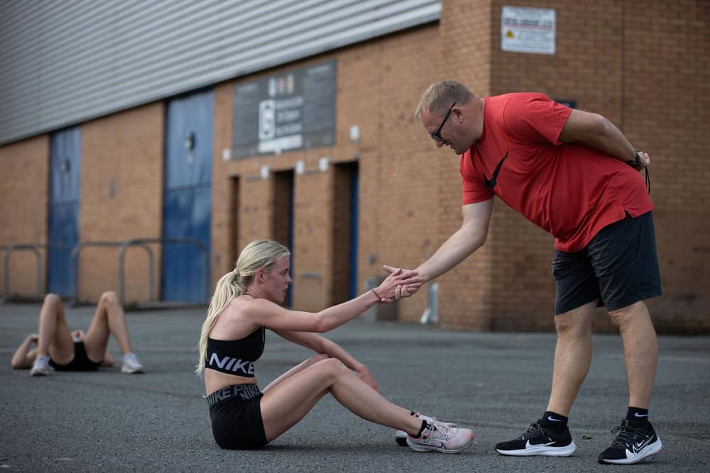 Keely Hodgkinson is giving a helping hand by coach Trevor Painter