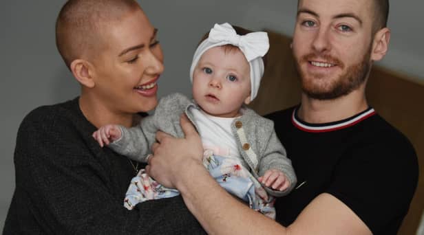 Estelle Wignall and husband Mike with their daughter Brooke, pictured last year