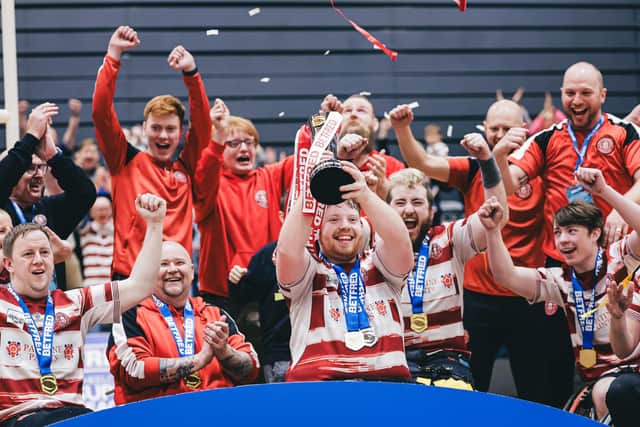 Wigan celebrate with the Wheelchair Super League trophy