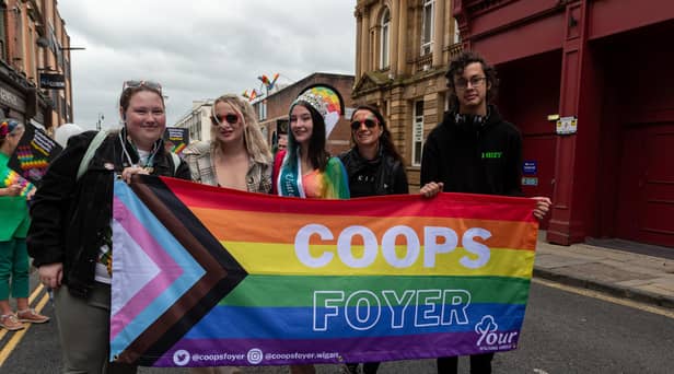 Wigan Pride parade through the streets of Wigan