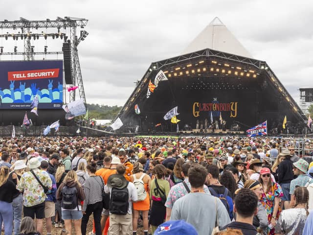 People enjoy the first proper day of Glastonbury Festival as the music gets underway.