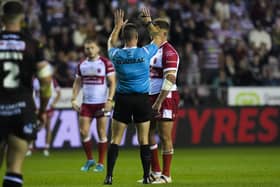 Referee Jack Smith sending Jai Whitbread of Hull KR to the sin bin against Wigan Warriors
