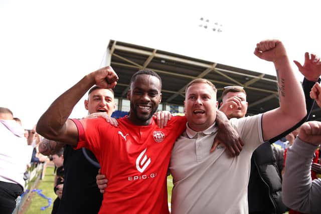 Gavin Massey celebrates with fans at Shrewsbury