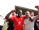 Gavin Massey celebrates with fans at Shrewsbury