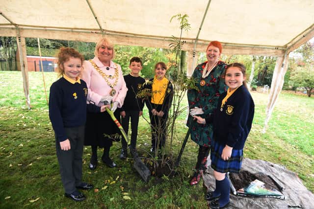 The Mayor of Wigan Coun Marie Morgan, left, and  Melanie Bryan OBE DL representing the Lord Lieutenant of Greater Manchester, were joined by pupils from St Michael's CE Primary School  and members of the community in a tree-planting ceremony at Colliers Corner, Howe Bridge.