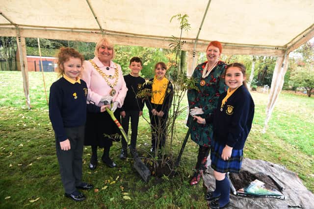 The Mayor of Wigan Coun Marie Morgan, left, and Melanie Bryan OBE DL representing the Lord Lieutenant of Greater Manchester, were joined by pupils from St Michael's CE Primary School and members of the community in a tree-planting ceremony at Colliers Corner, Howe Bridge.
