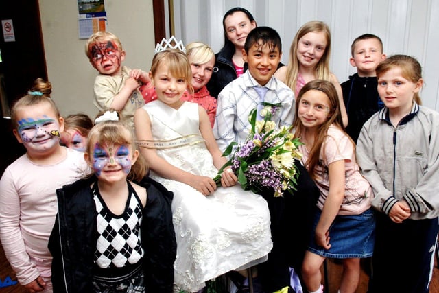 May Queen, Natasha Mahon and attendant Keanu Jones, with friends at a May Day event organised by Worsley Hall Tenants and Residents Group on Bank Holiday Monday 5th of May 2008.