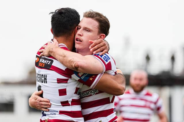 Jai Field celebrates with Bevan French as Wigan Warriors booked their place in the Challenge Cup semi-finals