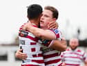 Jai Field celebrates with Bevan French as Wigan Warriors booked their place in the Challenge Cup semi-finals