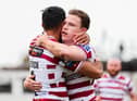 Jai Field celebrates with Bevan French as Wigan Warriors booked their place in the Challenge Cup semi-finals