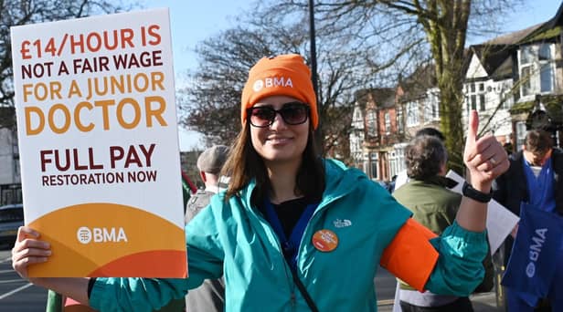 Junior doctor Behnaz Pourmohammadi on the picket line outside Wigan Infirmary during industrial action earlier this year