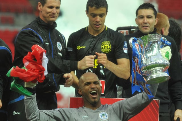 FA Cup Final 2013 - Wembley - Wigan Athletic v Manchester City
Wigan Athletic goalkeeper (who was on the bench for the match) Ali Al Habsi, celebrates with team mates as he holds the FA Cup trophy.