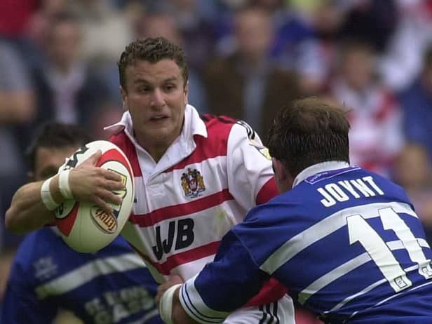 Pic...Ben Duffy...Wigan v St Helens.....09/07/2000..Copyright>>Simon Wilkinson..Wigan's Willie Peters tries to escape St Helen's Chris Joynt..