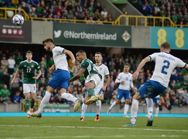 Josh Magennis heads home Northern Ireland's late winner against Kosovo