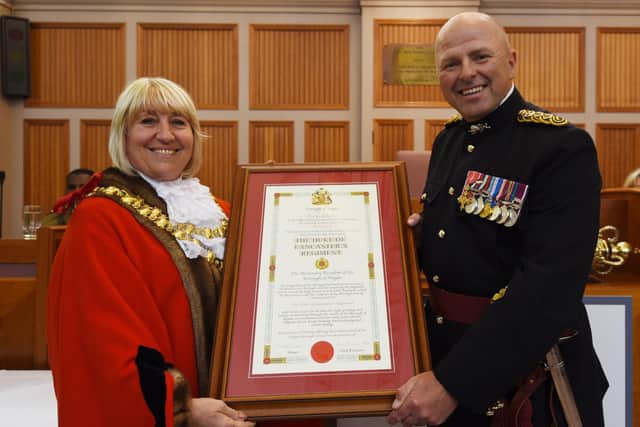 The Mayor of Wigan Coun Marie Morgan, left, makes a presentation to The Duke of Lancaster Regiment Colonel -  Brigadier Frazer Lawrence OBE, right.
The Duke of Lancaster's Regiment parade around Wigan Town Hall, celebrating being granted Freedom of the Borough by Wigan Council. 
The Mayor of Wigan Coun Marie Morgan, held a council meeting in Wigan Town Hall chambers to officially annouce and make presentations to the Colonel of the Regiment, Brigadier Frazer Lawrence OBE, before a parade and the Mayor of Wigan carried out an inspection.