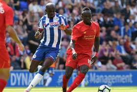 Sanmi Odelusi in action for Latics during a pre-season friendly against Liverpool in 2016