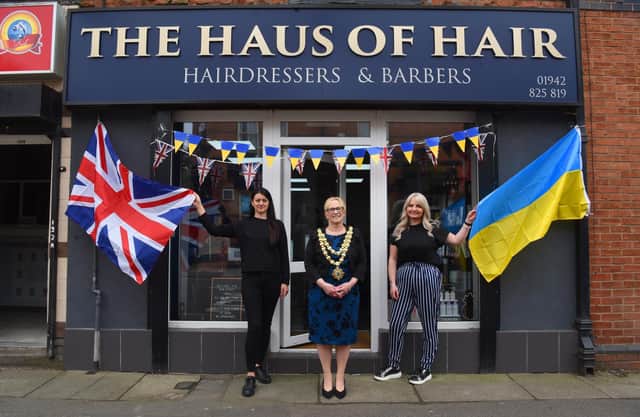 Photo Neil Cross; Mayor of Wigan Councillor Yvonne Klieve meets the new Ukraine refugee and salon employee, Inna Hashynskya, with salon owner, Joanne Cottom at Haus of Hair