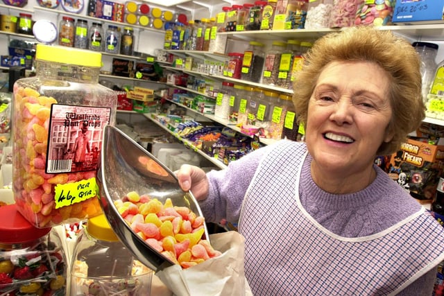 Irene Westhead celebrates National Toffee Week in her Gidlow Lane shop on Tuesday 28th of October 2003.
The sweet shop had not changed in tradition in 62 years still selling everything including pear drops, cinder toffee, rum and butter toffee and chocolate raisins from traditional toffee jars and in white bags. The family business was started by Irene's parents Rose and Bob in 1927.