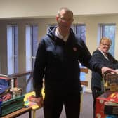 Majors Mark and Alison Lewis receiving gifts for The Salvation Army to redistribute to children at Christmas