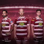 Skipper Liam Farrell (central) models the 2024 Wigan Warriors home kit with Bevan French (left) and Ethan Havard (right). Photo courtesy of Wigan Warriors.