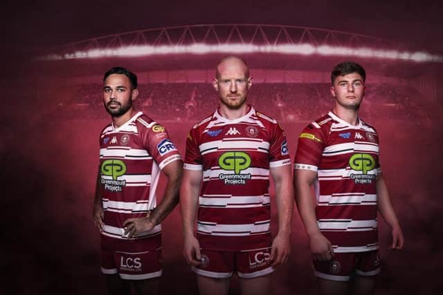 Skipper Liam Farrell (central) models the 2024 Wigan Warriors home kit with Bevan French (left) and Ethan Havard (right). Photo courtesy of Wigan Warriors.