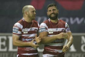 Abbas Miski celebrates with Liam Marshall following the victory over Huddersfield