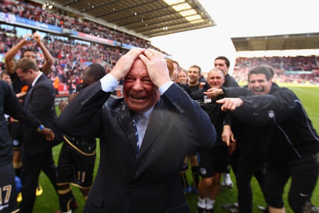 Dave Whelan, Chairman of Wigan Athletic is soaked with champagne after his team beat Stoke 1-0 to keep them in the Premier League at Britannia Stadium on May 22, 2011