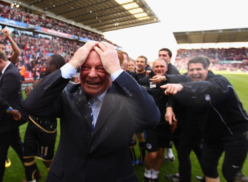 Dave Whelan, Chairman of Wigan Athletic is soaked with champagne after his team beat Stoke 1-0 to keep them in the Premier League at Britannia Stadium on May 22, 2011