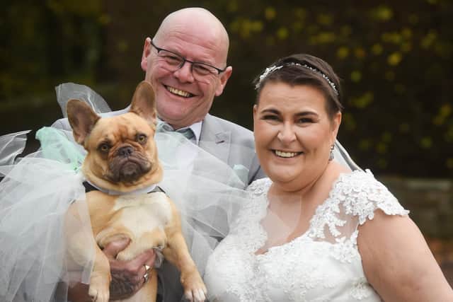 Sarah and Mark Rook renew their wedding vows at Ferrari's Country House Hotel & Restaurant. They are pictured with dog Nellie.