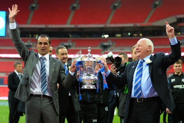 (L-R) Manager Roberto Martinez of Wigan Athletic and Wigan chairman Dave Whelan celebrate with the trophy following his team's 1-0 victory during the FA Cup with Budweiser Final between Manchester City and Wigan Athletic at Wembley Stadium on May 11, 2013 in London, England.