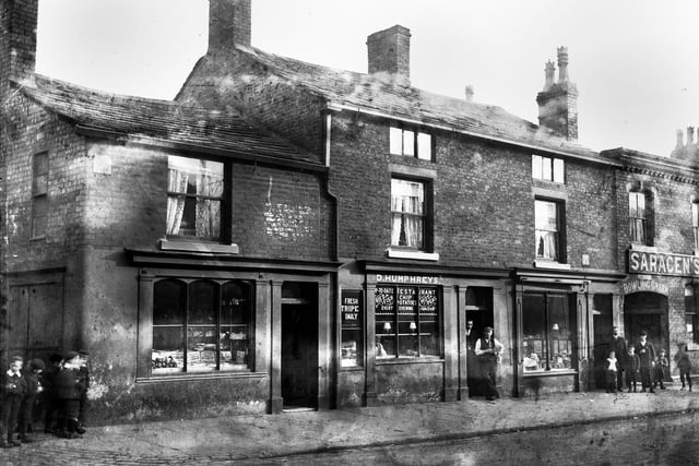 D. Humphreys fish and chip restaurant and the Saracen's Head pub on Wigan Lane around 1900.