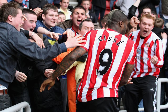 Djibril Cisse of Sunderland celebrates with fans after scoring his team's first goal during the Premier League match between Sunderland and Hull at the Stadium of Light on April 18, 2009.