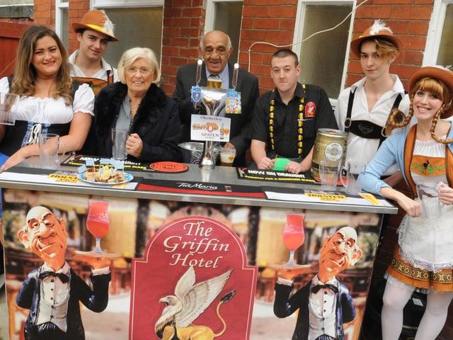 Billy and Joan Boston officially open the Oktoberfest celebrations in the pub they used to manage - The Griffin Hotel, Standishgate - with appropriately dressed staff