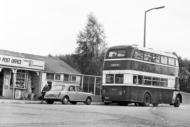 The junction of Chorley Road and Wigan Road with the Boars Head post office on the left in 1972 and some classic vehicles in view.