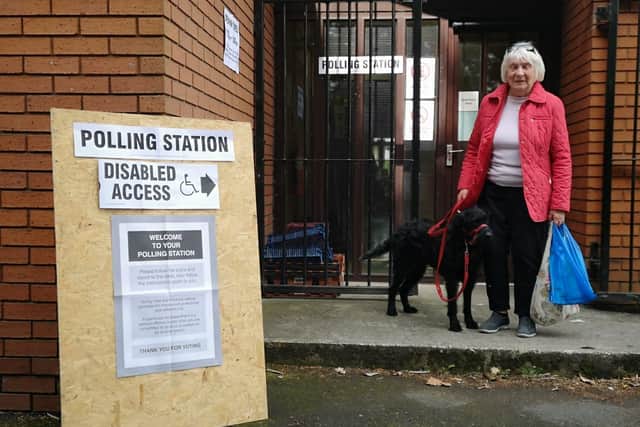 Lottie Labradoodle pictured with Wigan voter, Jean Derbyshire.