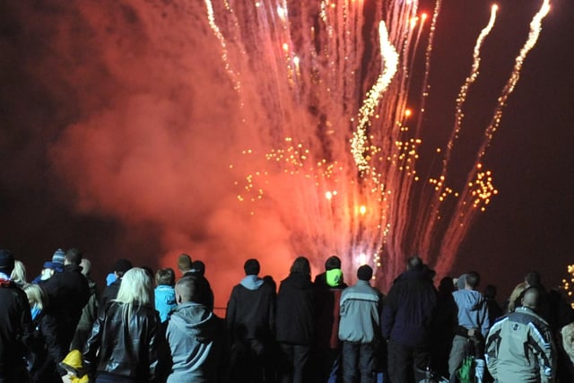 A crowd watch the fireworks display at Haigh Hall  in 2009