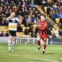 Chris Sze celebrates his goal before the 'mass confrontation' between both sets of players at Port Vale last month